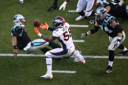 Von Miller (58) sacks Cam Newton (1) and forces the ball free. The Broncos recover the fumble for the first touchdown of the game
